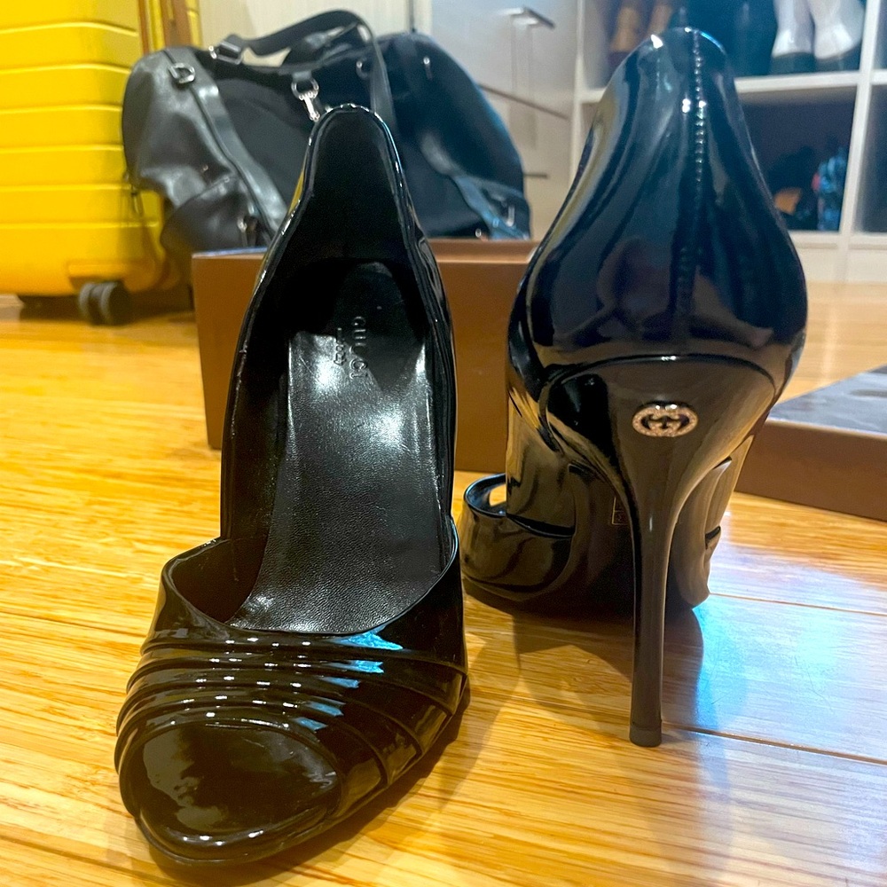 Black patent peep toe stilettos Gucci. Size 7